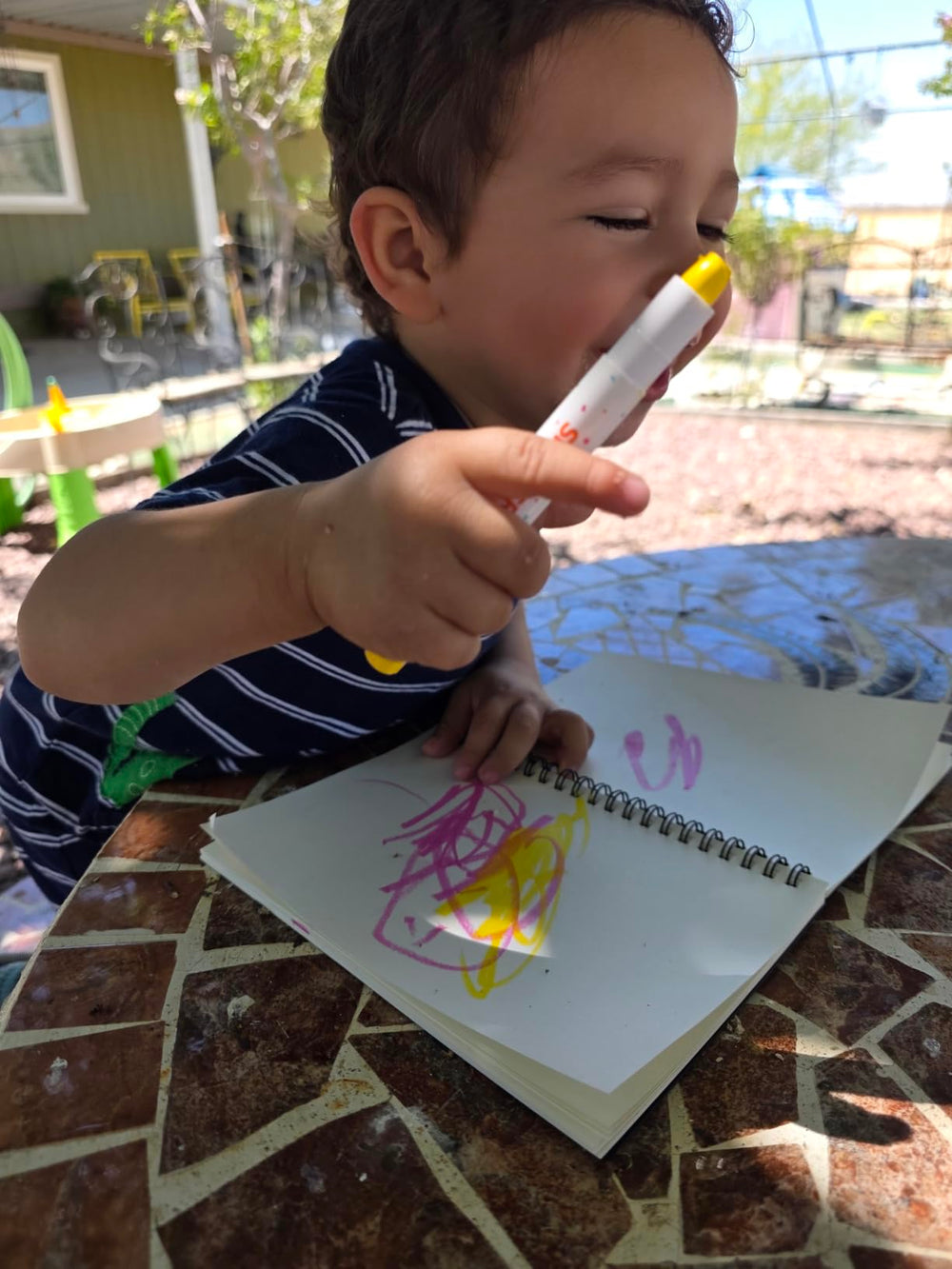 Colourful crayons being used on paper